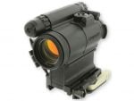 Black Aimpoint red dot sight optic with orange lens coating
