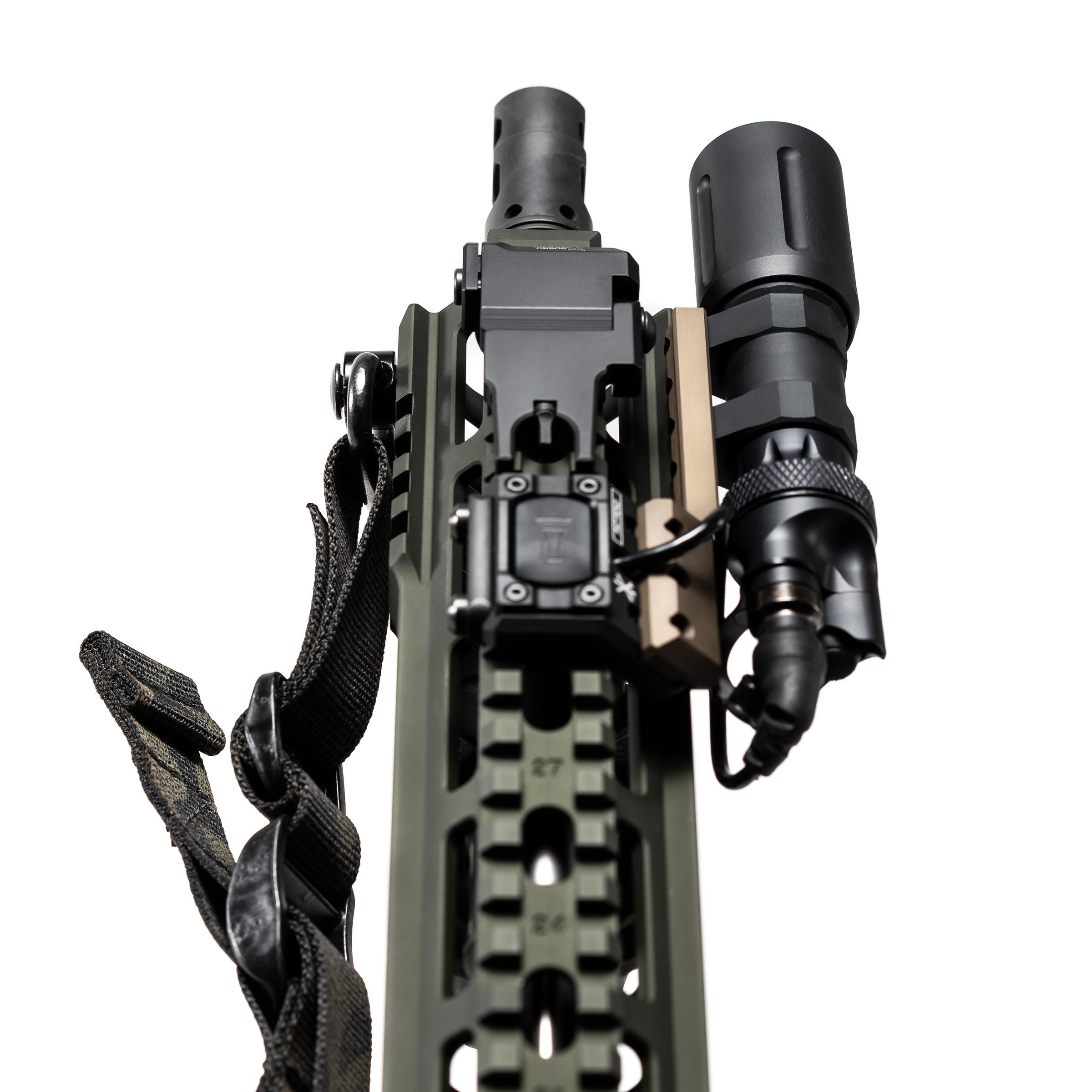 Close-up of a firearm accessory rail with mounted Modlite flashlight and black strap on white background.