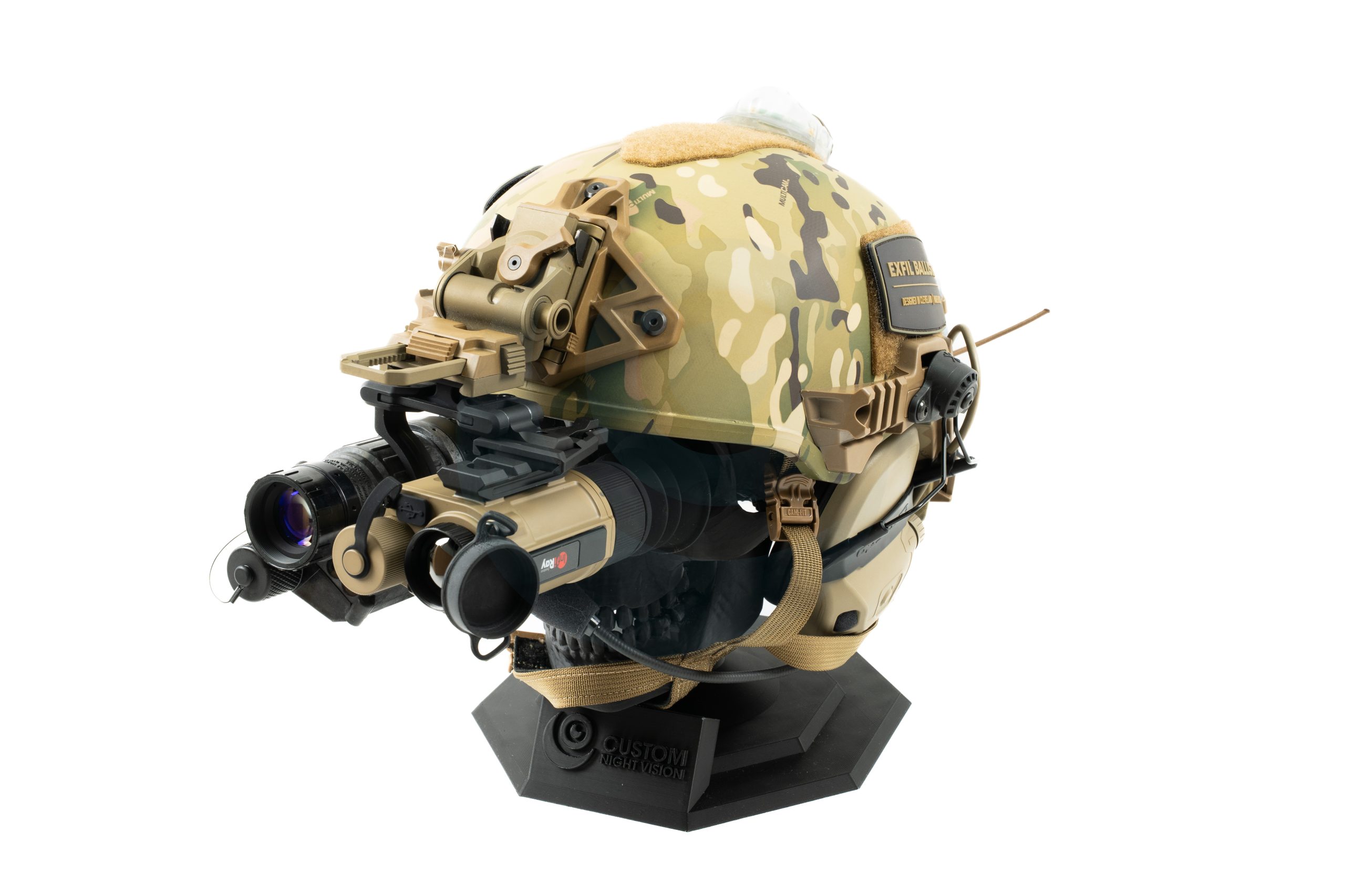 Camouflage tactical helmet with night vision goggles on a display stand
