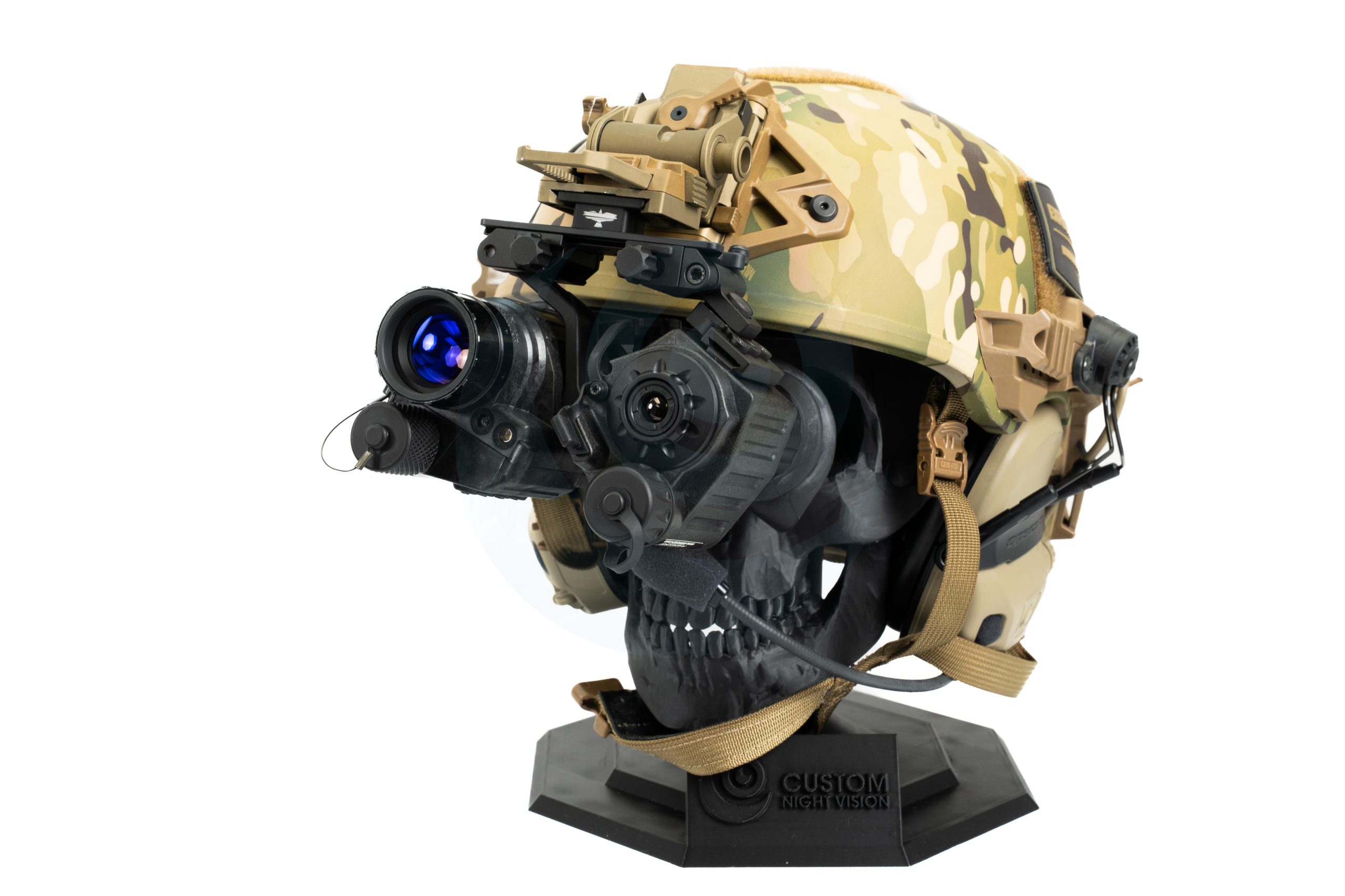 Military helmet with mounted night vision device on a display stand