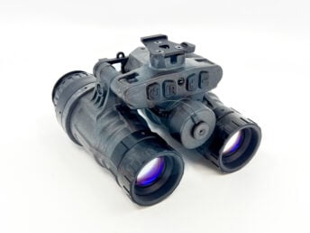 Black night vision binoculars with adjustment buttons on top against white background