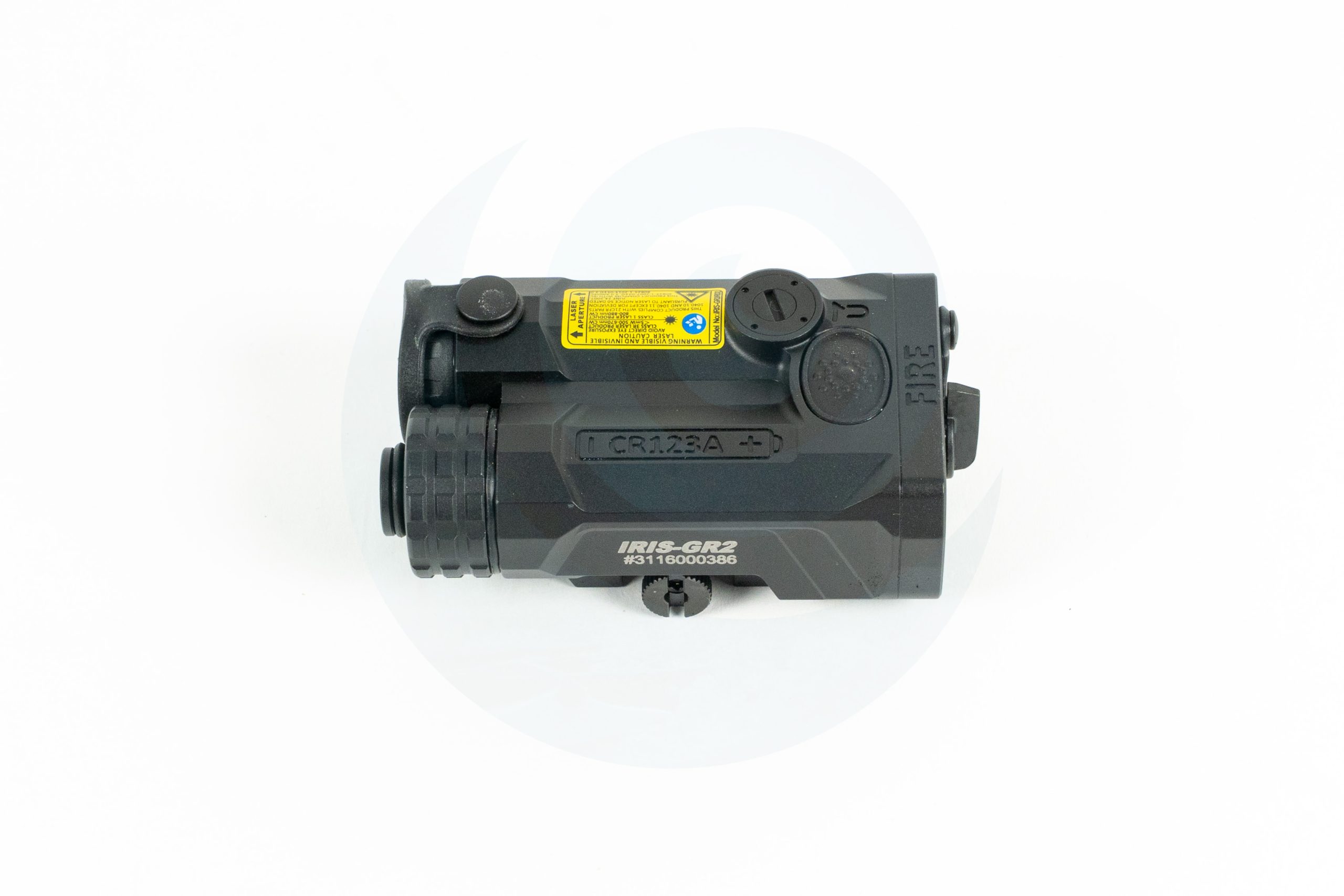 Compact tactical night vision device with control knobs and a yellow warning label on white background.