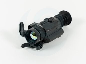 Night vision scope with buttons and lens cover on a white background.