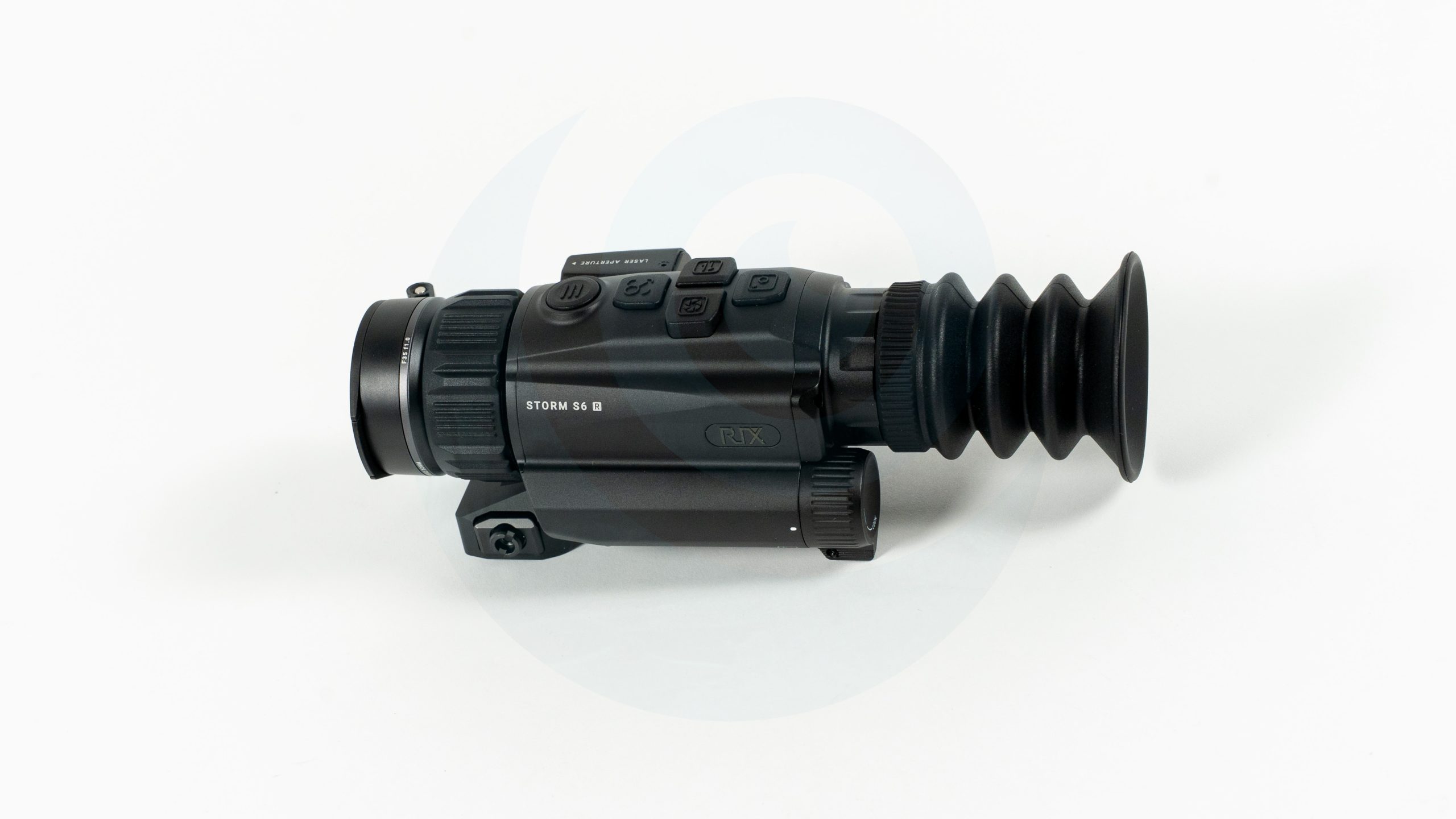 Black night vision optic device on a white background.
