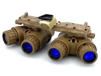 Tan quad-tube night vision goggles with blue lenses on a white background.