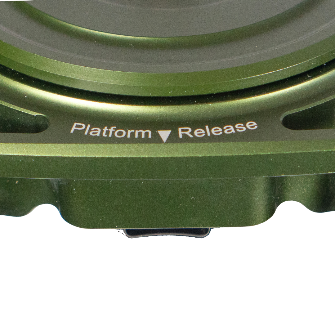 Close-up of a green metal device labeled 'Platform Release'.