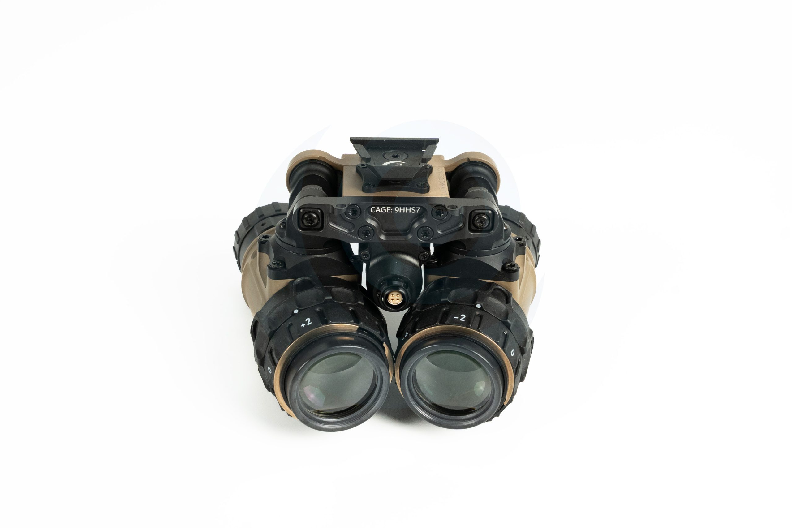 Front view of night vision goggles with tan and black housing on a white background.