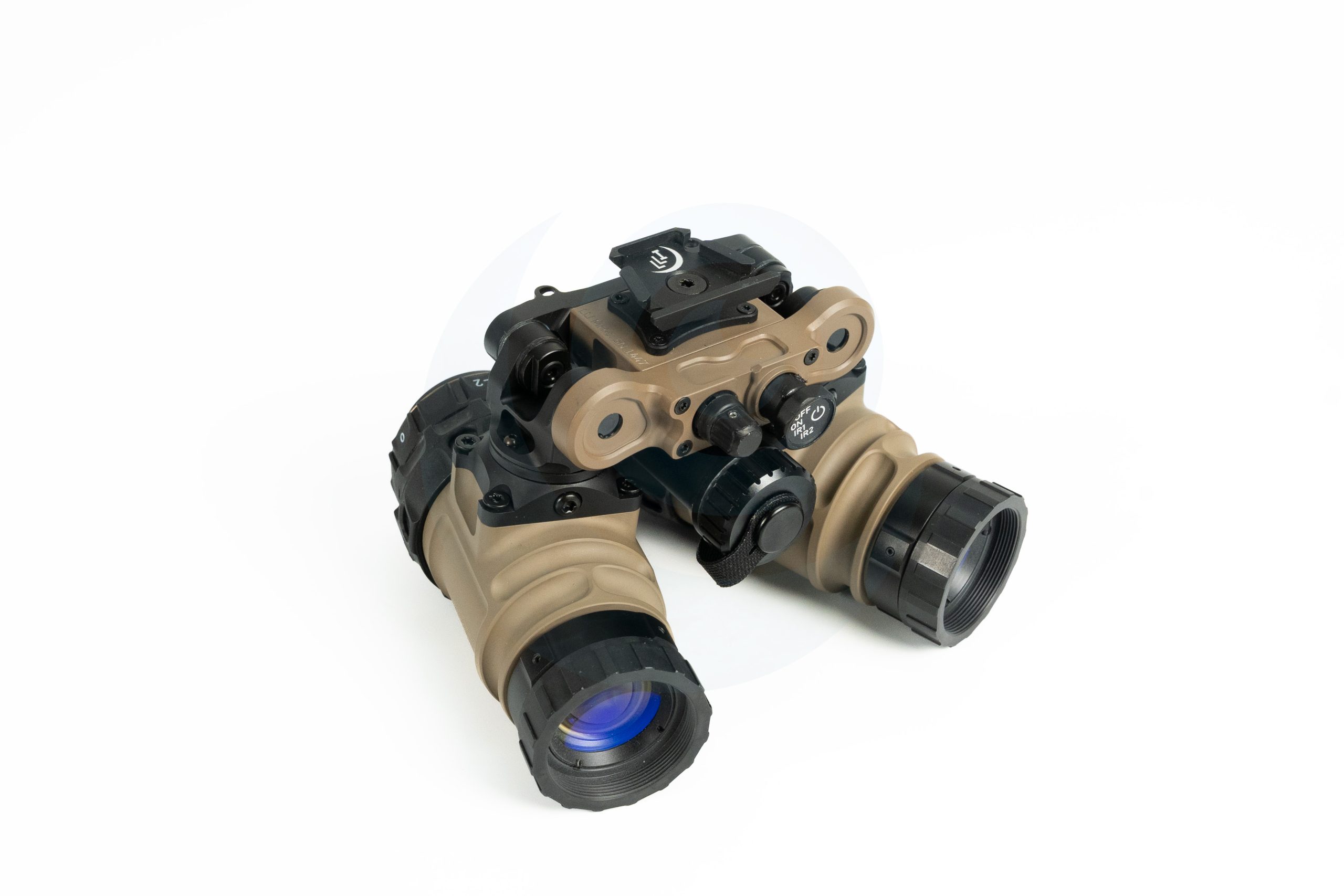Dual-tube night vision goggles with tan housing on a white background.