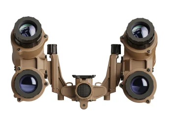 Front view of a tan night vision goggle device with four large optical lenses.