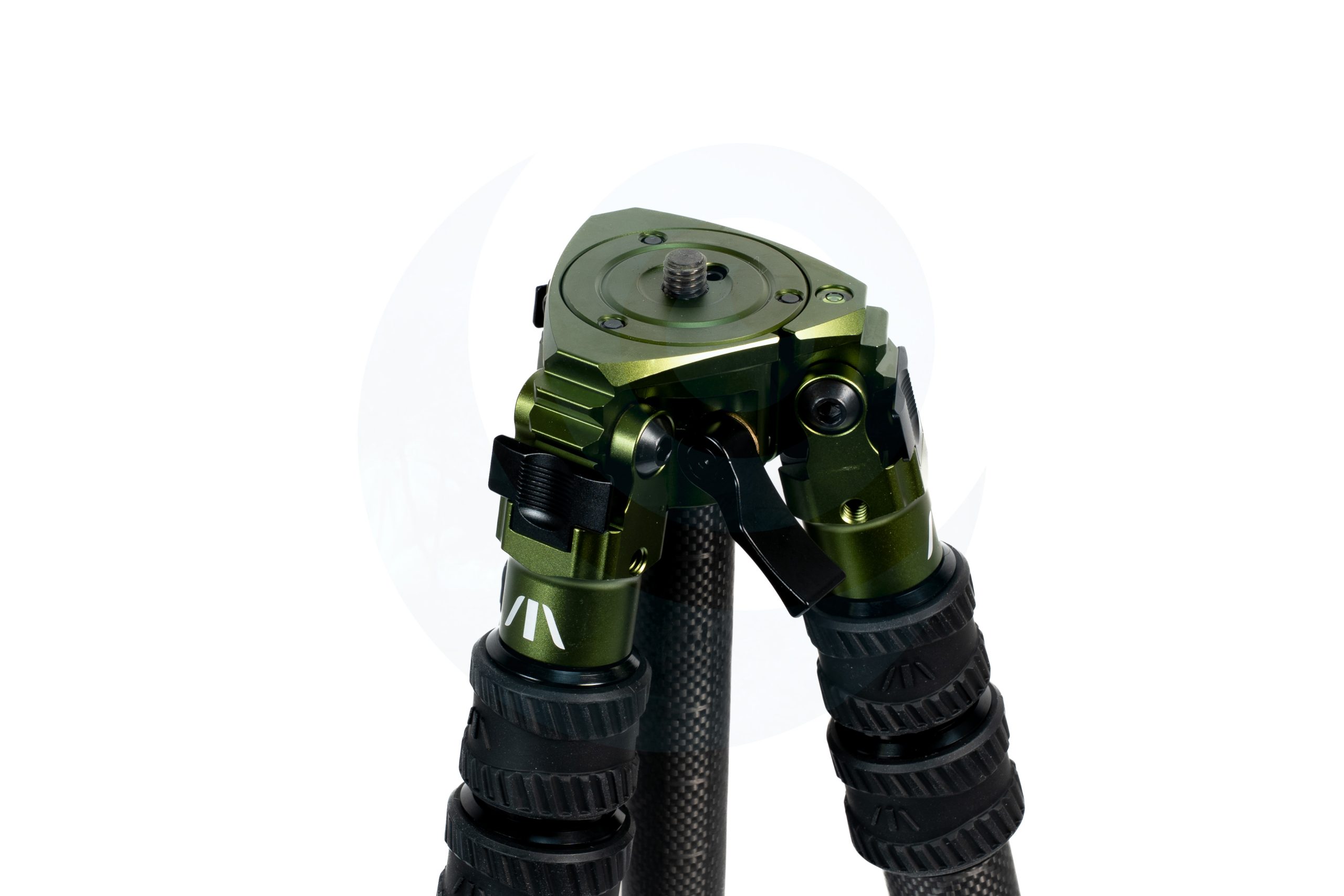 Close-up of a green and black tripod head with adjustable legs.