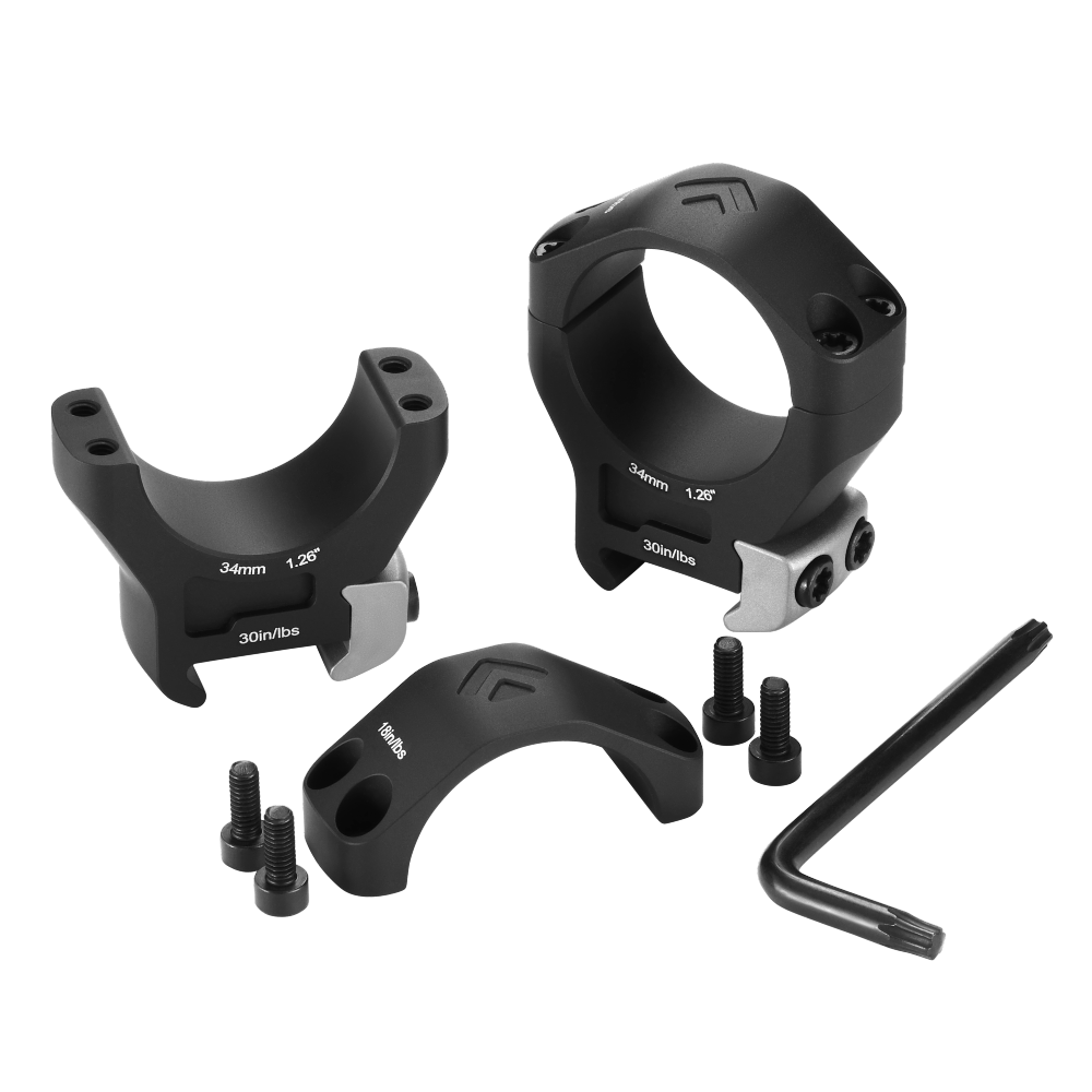 Scope rings and mounting hardware with screws and hex key on white background.