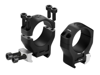 Two black scope rings with mounting screws on a white background.